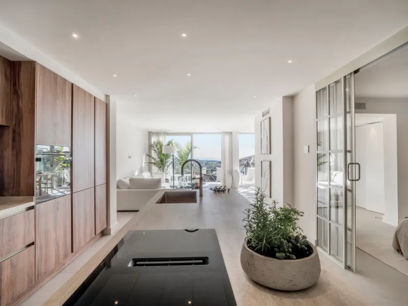 This exquisite 3-bedroom ground-floor apartment in Nueva Andalucía, Marbella, epitomizes modern luxury and comfort. Recently renovated to the highest standards, the property features an open-plan living and dining area, perfectly designed for seamless ent