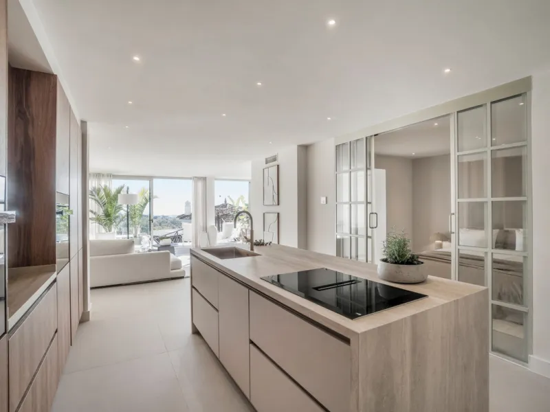 This exquisite 3-bedroom ground-floor apartment in Nueva Andalucía, Marbella, epitomizes modern luxury and comfort. Recently renovated to the highest standards, the property features an open-plan living and dining area, perfectly designed for seamless ent