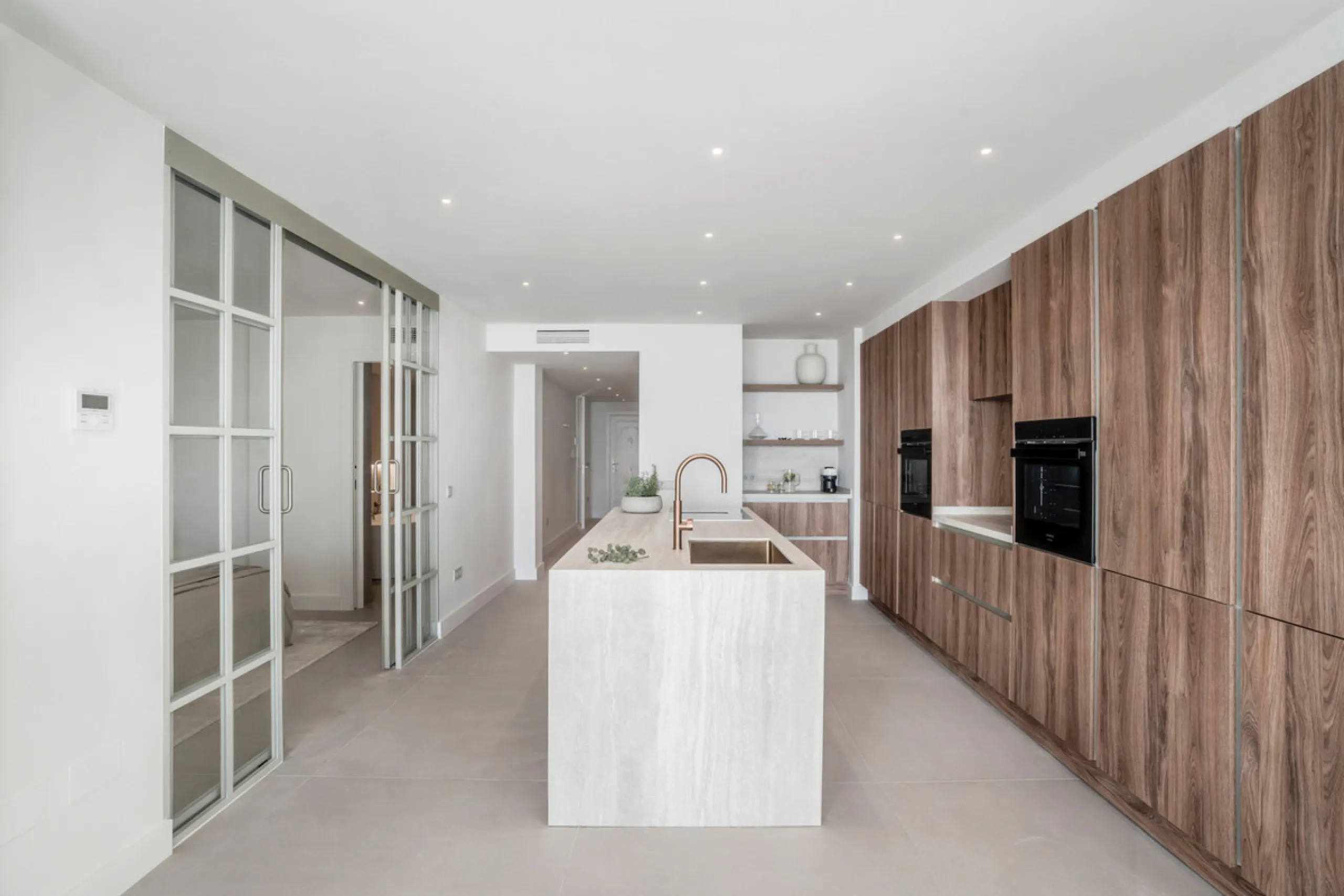 This exquisite 3-bedroom ground-floor apartment in Nueva Andalucía, Marbella, epitomizes modern luxury and comfort. Recently renovated to the highest standards, the property features an open-plan living and dining area, perfectly designed for seamless ent