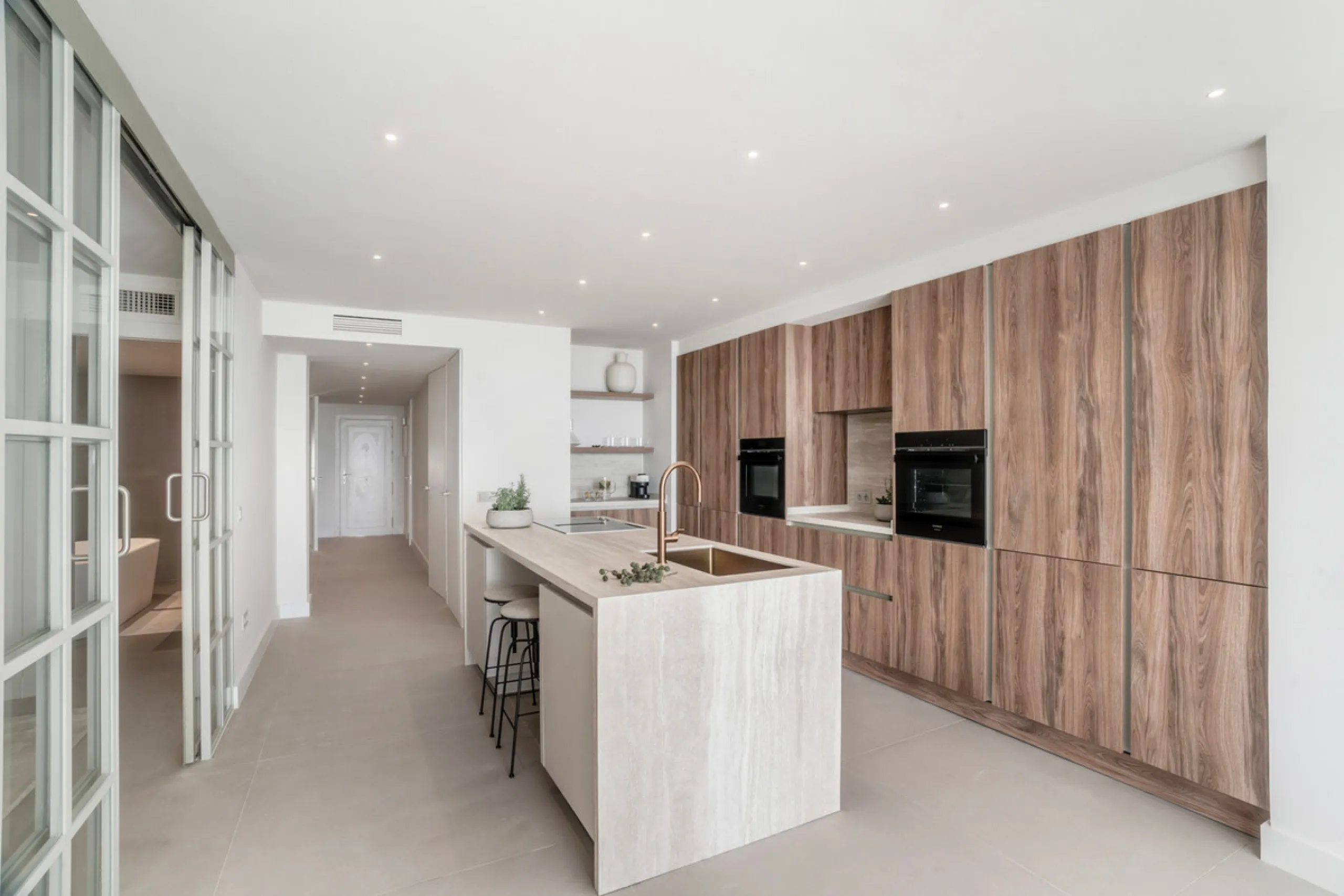 This exquisite 3-bedroom ground-floor apartment in Nueva Andalucía, Marbella, epitomizes modern luxury and comfort. Recently renovated to the highest standards, the property features an open-plan living and dining area, perfectly designed for seamless ent