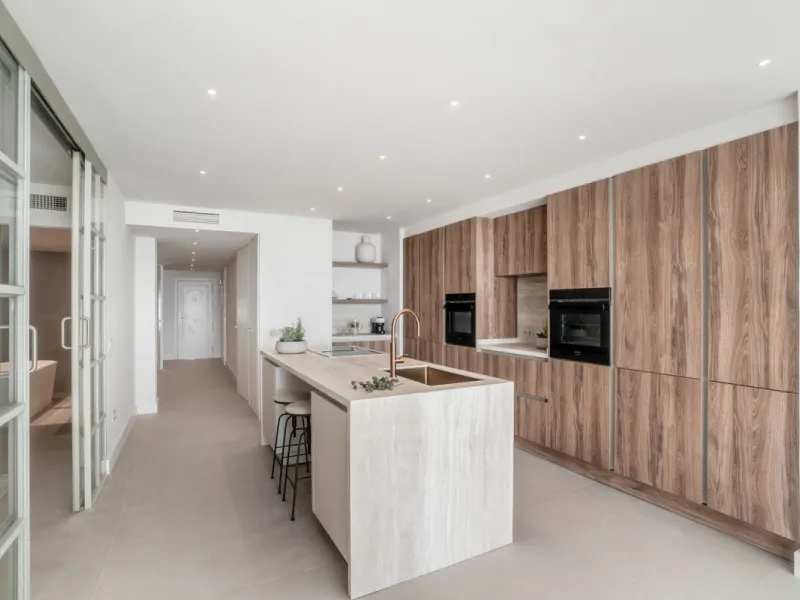 This exquisite 3-bedroom ground-floor apartment in Nueva Andalucía, Marbella, epitomizes modern luxury and comfort. Recently renovated to the highest standards, the property features an open-plan living and dining area, perfectly designed for seamless ent