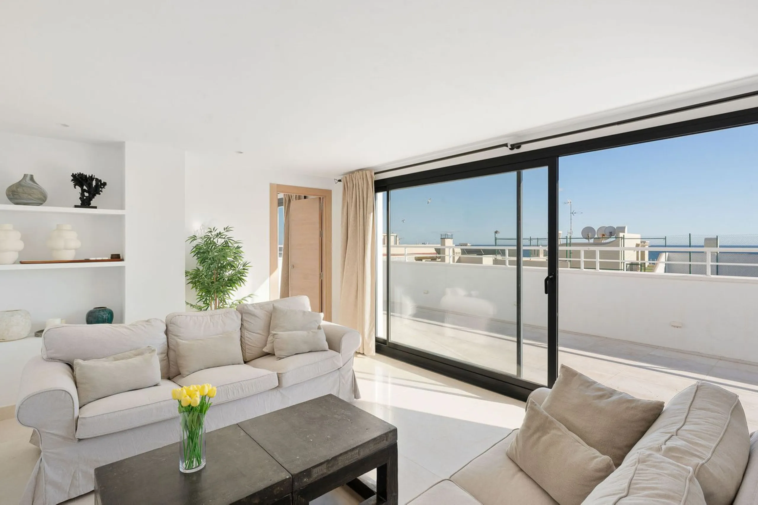 A very special penthouse situated 2nd line to the beach right in the centre of Estepona. The penthouse and terraces occupy the whole of the 6th floor on this building making it one of a kind and very private. The good size living and dining room have acce