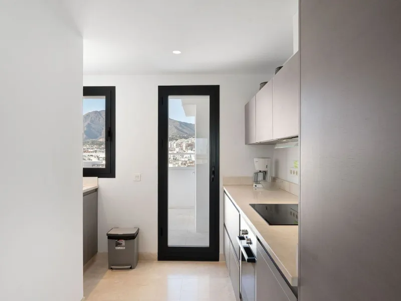 A very special penthouse situated 2nd line to the beach right in the centre of Estepona. The penthouse and terraces occupy the whole of the 6th floor on this building making it one of a kind and very private. The good size living and dining room have acce