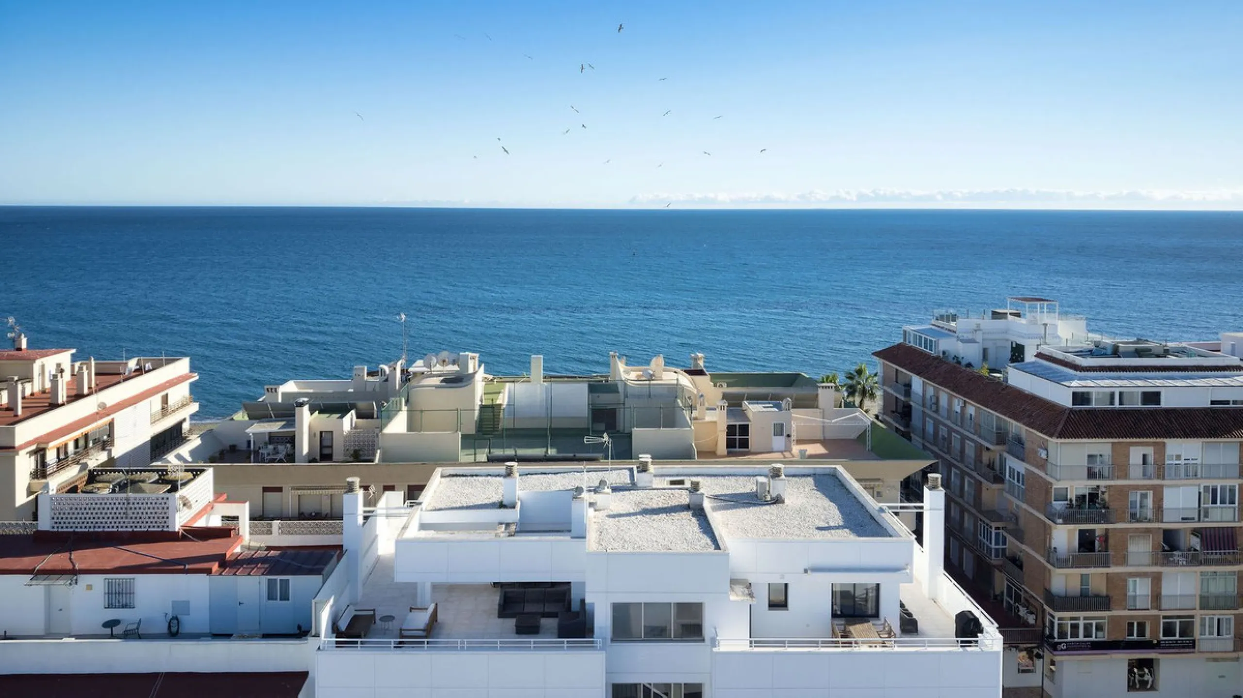 A very special penthouse situated 2nd line to the beach right in the centre of Estepona. The penthouse and terraces occupy the whole of the 6th floor on this building making it one of a kind and very private. The good size living and dining room have acce
