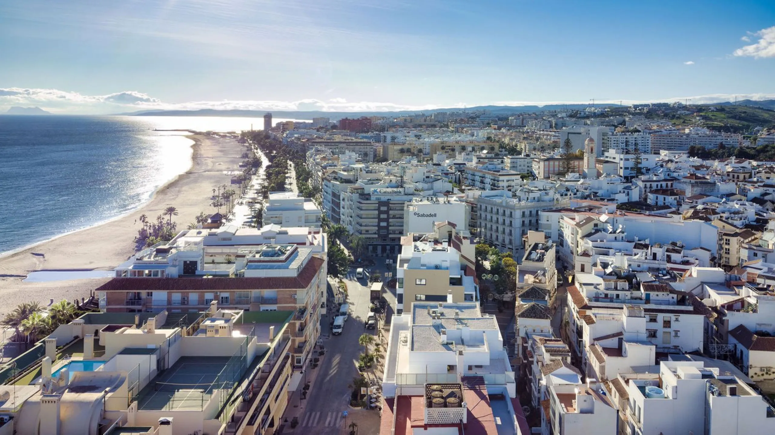 A very special penthouse situated 2nd line to the beach right in the centre of Estepona. The penthouse and terraces occupy the whole of the 6th floor on this building making it one of a kind and very private. The good size living and dining room have acce