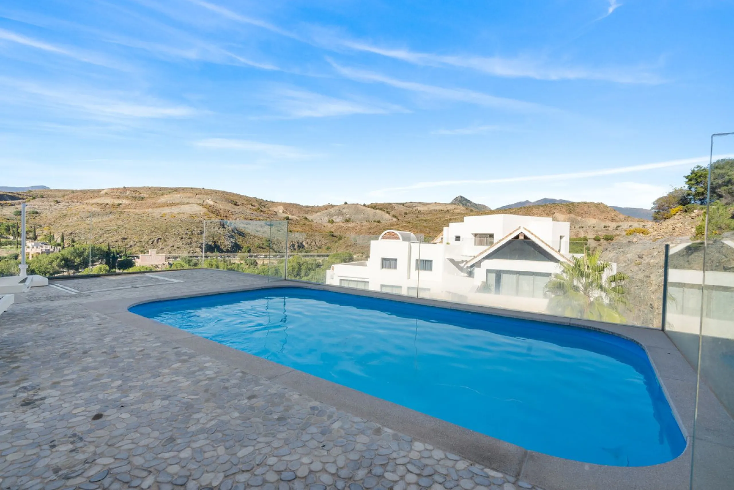 Experience luxury living in this stunning penthouse located in the exclusive complex of Los Flamingos Golf, Tee 5.