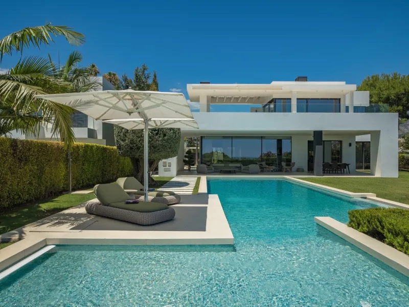 This exceptional villa is nestled within an exclusive gated community in Marbella's prestigious Golden Mile. Set on a generous south-facing plot, the property is bathed in natural sunlight and enjoys breathtaking panoramic sea views from both floors, crea