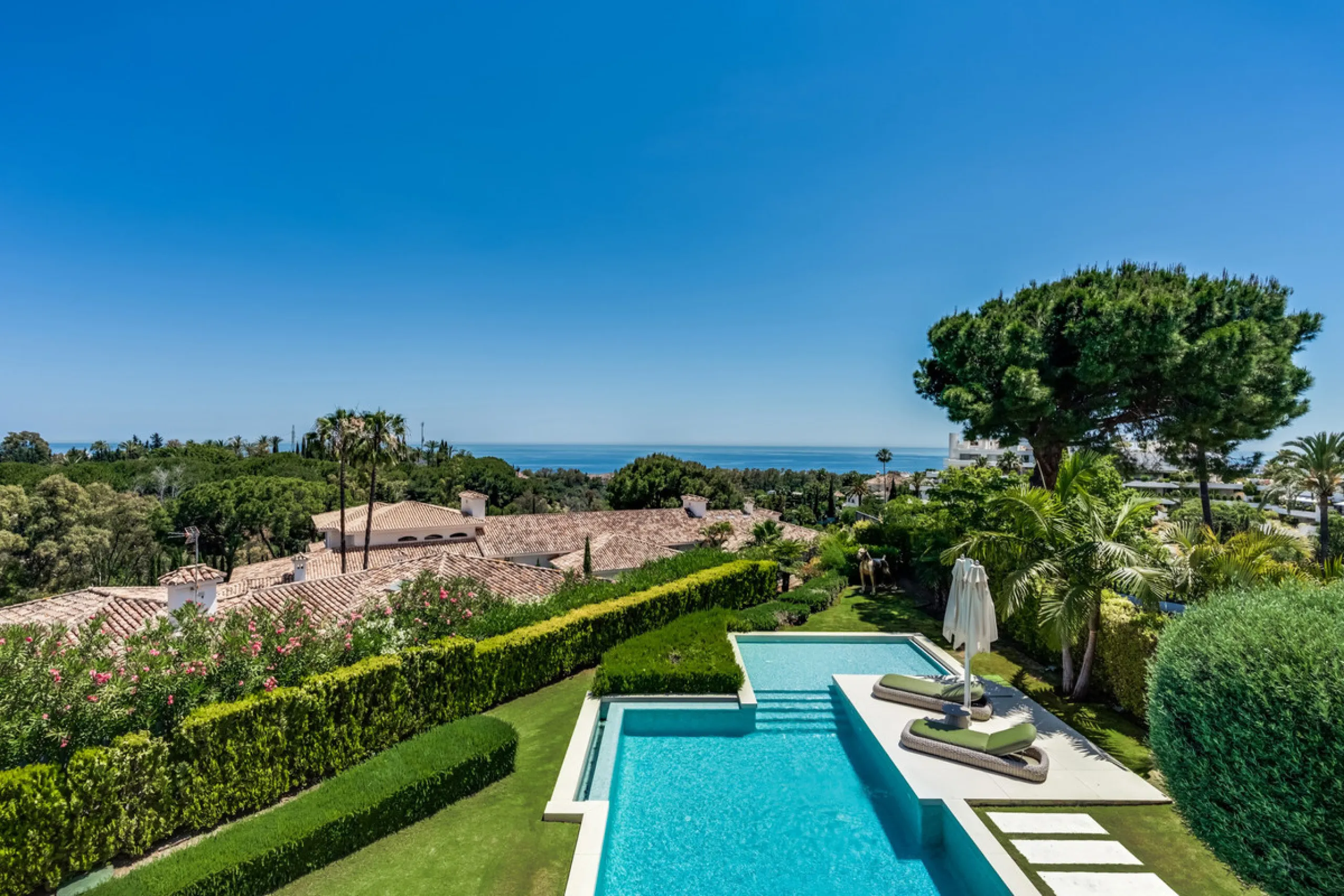 This exceptional villa is nestled within an exclusive gated community in Marbella's prestigious Golden Mile. Set on a generous south-facing plot, the property is bathed in natural sunlight and enjoys breathtaking panoramic sea views from both floors, crea