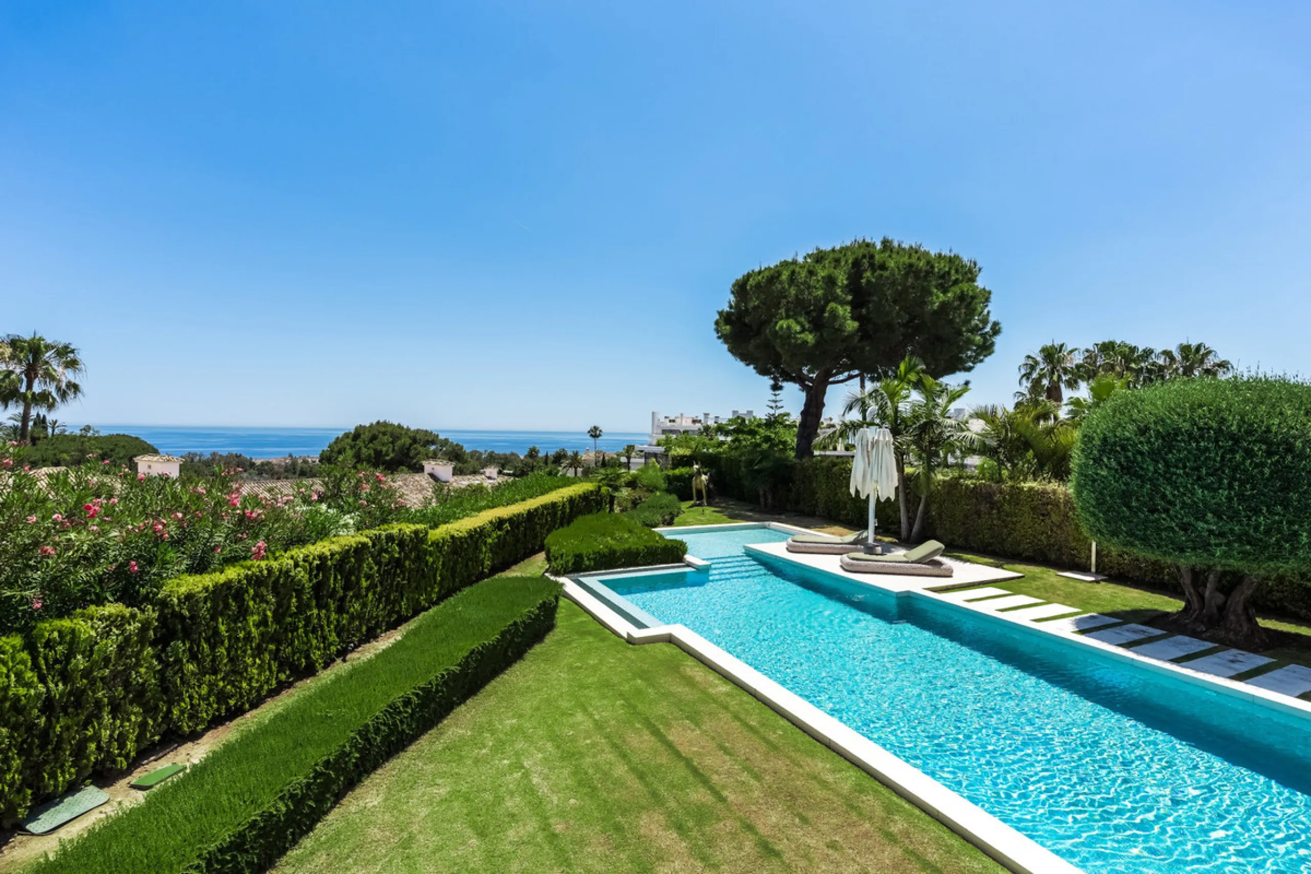 This exceptional villa is nestled within an exclusive gated community in Marbella's prestigious Golden Mile. Set on a generous south-facing plot, the property is bathed in natural sunlight and enjoys breathtaking panoramic sea views from both floors, crea