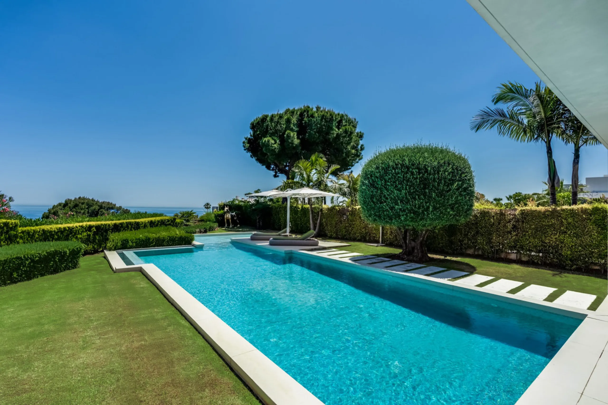 This exceptional villa is nestled within an exclusive gated community in Marbella's prestigious Golden Mile. Set on a generous south-facing plot, the property is bathed in natural sunlight and enjoys breathtaking panoramic sea views from both floors, crea
