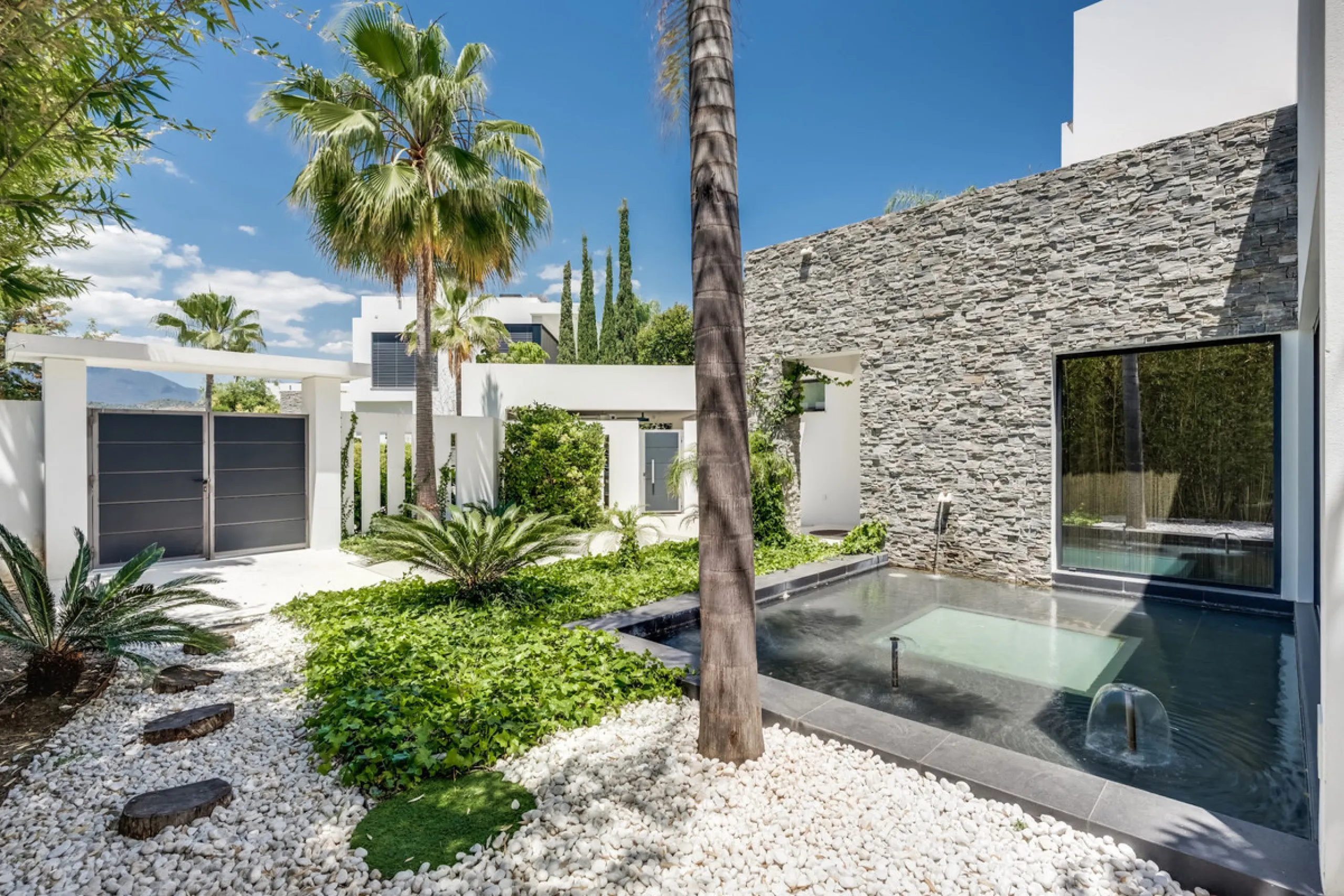 This exceptional villa is nestled within an exclusive gated community in Marbella's prestigious Golden Mile. Set on a generous south-facing plot, the property is bathed in natural sunlight and enjoys breathtaking panoramic sea views from both floors, crea