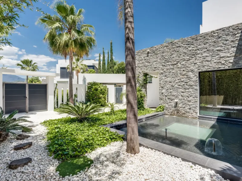 This exceptional villa is nestled within an exclusive gated community in Marbella's prestigious Golden Mile. Set on a generous south-facing plot, the property is bathed in natural sunlight and enjoys breathtaking panoramic sea views from both floors, crea