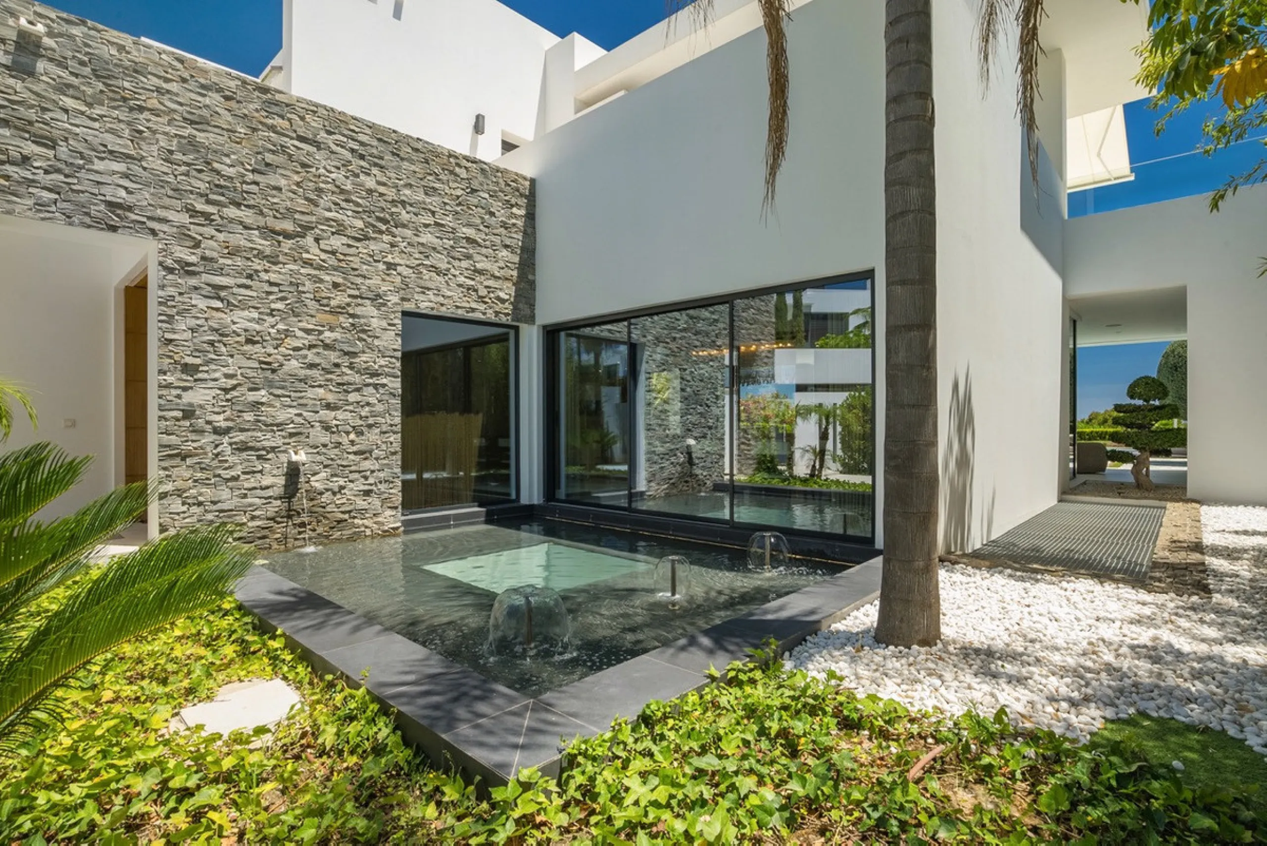 This exceptional villa is nestled within an exclusive gated community in Marbella's prestigious Golden Mile. Set on a generous south-facing plot, the property is bathed in natural sunlight and enjoys breathtaking panoramic sea views from both floors, crea
