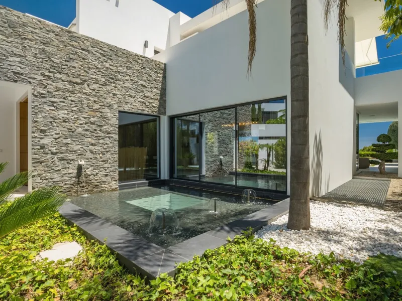 This exceptional villa is nestled within an exclusive gated community in Marbella's prestigious Golden Mile. Set on a generous south-facing plot, the property is bathed in natural sunlight and enjoys breathtaking panoramic sea views from both floors, crea