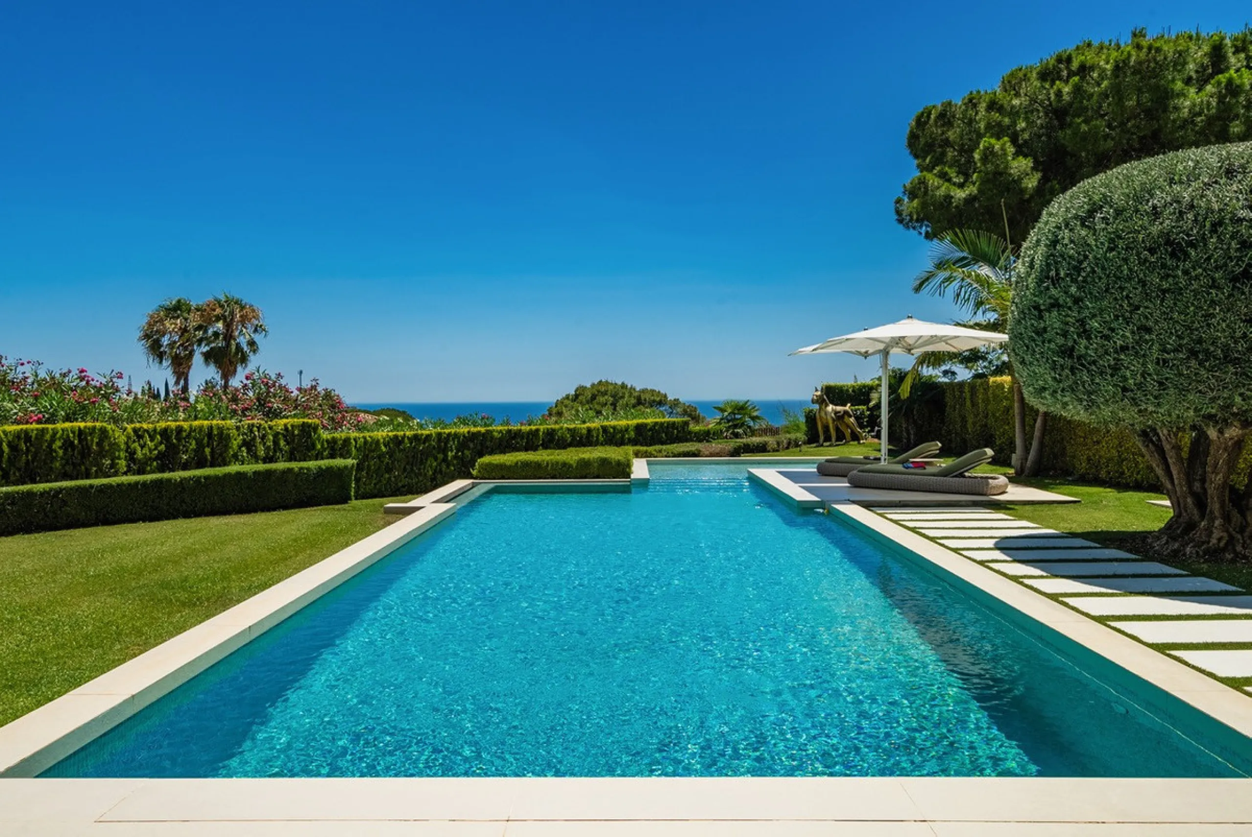 This exceptional villa is nestled within an exclusive gated community in Marbella's prestigious Golden Mile. Set on a generous south-facing plot, the property is bathed in natural sunlight and enjoys breathtaking panoramic sea views from both floors, crea