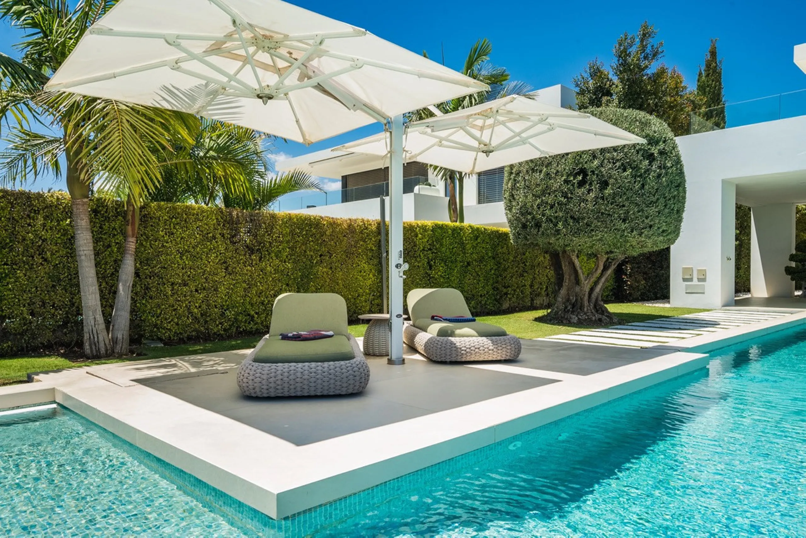 This exceptional villa is nestled within an exclusive gated community in Marbella's prestigious Golden Mile. Set on a generous south-facing plot, the property is bathed in natural sunlight and enjoys breathtaking panoramic sea views from both floors, crea
