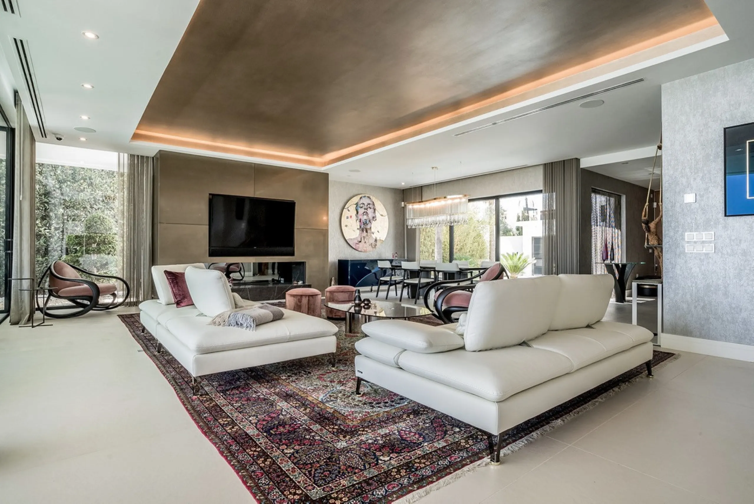 This exceptional villa is nestled within an exclusive gated community in Marbella's prestigious Golden Mile. Set on a generous south-facing plot, the property is bathed in natural sunlight and enjoys breathtaking panoramic sea views from both floors, crea