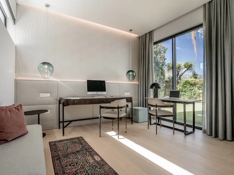 This exceptional villa is nestled within an exclusive gated community in Marbella's prestigious Golden Mile. Set on a generous south-facing plot, the property is bathed in natural sunlight and enjoys breathtaking panoramic sea views from both floors, crea