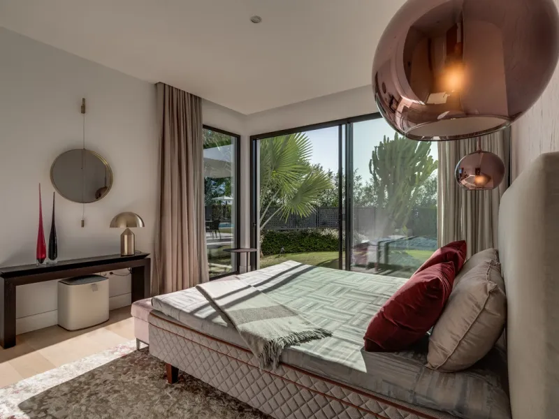 This exceptional villa is nestled within an exclusive gated community in Marbella's prestigious Golden Mile. Set on a generous south-facing plot, the property is bathed in natural sunlight and enjoys breathtaking panoramic sea views from both floors, crea