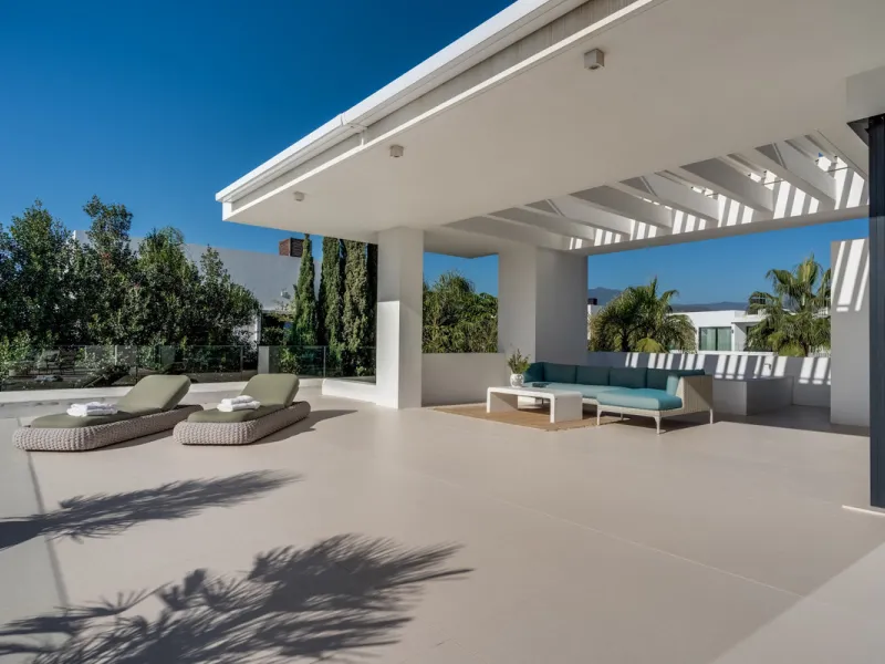 This exceptional villa is nestled within an exclusive gated community in Marbella's prestigious Golden Mile. Set on a generous south-facing plot, the property is bathed in natural sunlight and enjoys breathtaking panoramic sea views from both floors, crea