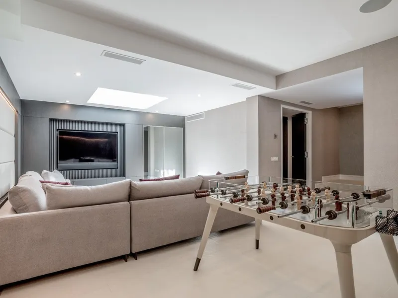 This exceptional villa is nestled within an exclusive gated community in Marbella's prestigious Golden Mile. Set on a generous south-facing plot, the property is bathed in natural sunlight and enjoys breathtaking panoramic sea views from both floors, crea