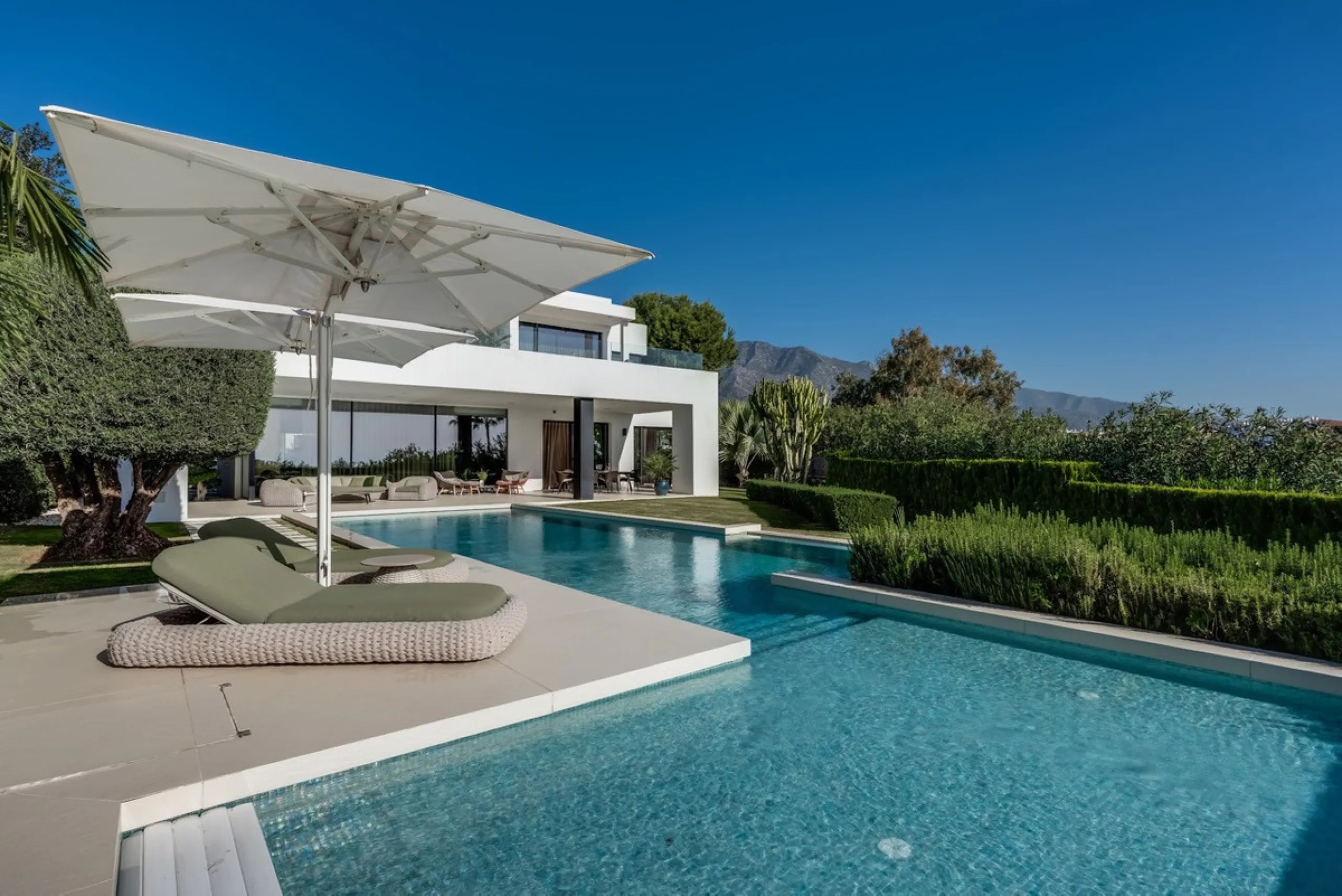 This exceptional villa is nestled within an exclusive gated community in Marbella's prestigious Golden Mile. Set on a generous south-facing plot, the property is bathed in natural sunlight and enjoys breathtaking panoramic sea views from both floors, crea