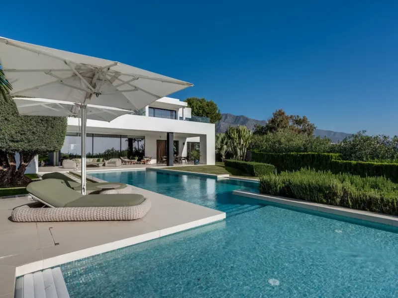 This exceptional villa is nestled within an exclusive gated community in Marbella's prestigious Golden Mile. Set on a generous south-facing plot, the property is bathed in natural sunlight and enjoys breathtaking panoramic sea views from both floors, crea
