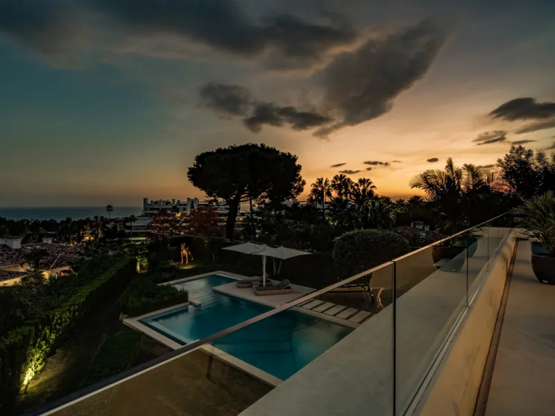 This exceptional villa is nestled within an exclusive gated community in Marbella's prestigious Golden Mile. Set on a generous south-facing plot, the property is bathed in natural sunlight and enjoys breathtaking panoramic sea views from both floors, crea