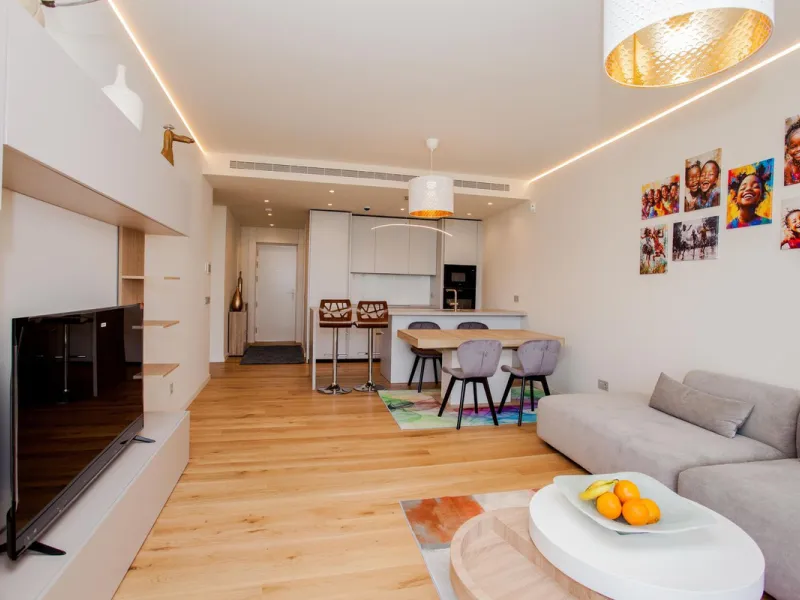 This stunning 2-bedroom ground floor apartment offers an exceptional living experience with 89 m² of constructed interior space, a 32 m² terrace, and a 73 m² private garden. Built with meticulous attention to detail, the apartment blends modern design wit