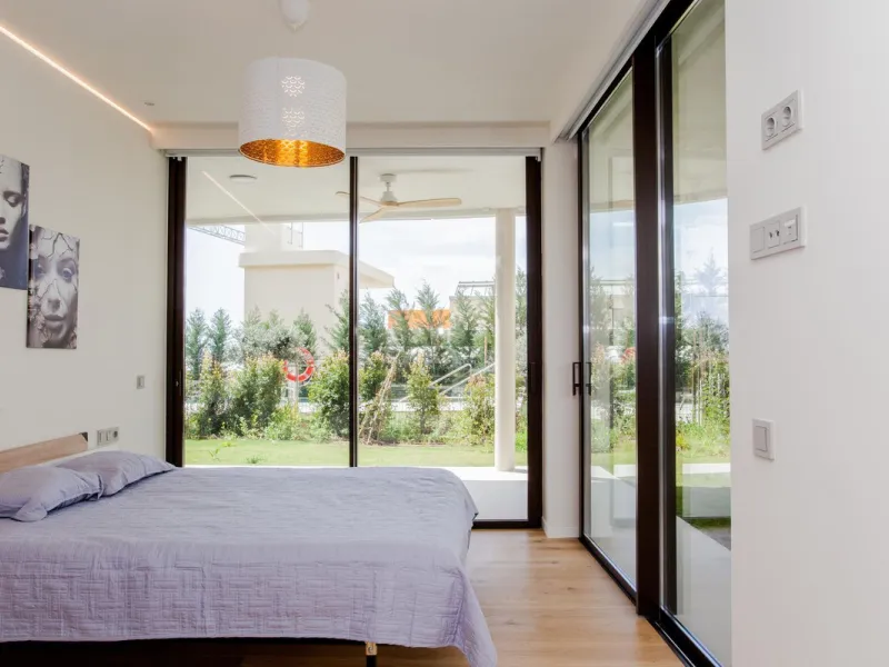 This stunning 2-bedroom ground floor apartment offers an exceptional living experience with 89 m² of constructed interior space, a 32 m² terrace, and a 73 m² private garden. Built with meticulous attention to detail, the apartment blends modern design wit
