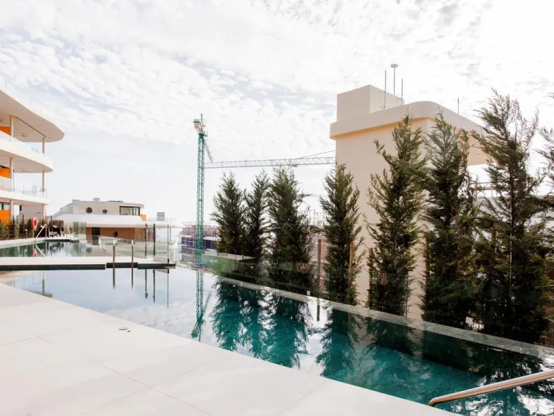 This stunning 2-bedroom ground floor apartment offers an exceptional living experience with 89 m² of constructed interior space, a 32 m² terrace, and a 73 m² private garden. Built with meticulous attention to detail, the apartment blends modern design wit