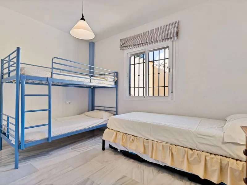 This magnificent townhouse in  Nueva Andalucía, Marbella—a prime location between Puerto Banús and San Pedro de Alcántara. The property, with a south-facing orientation that ensures natural light throughout the day, offers direct access to the communal po