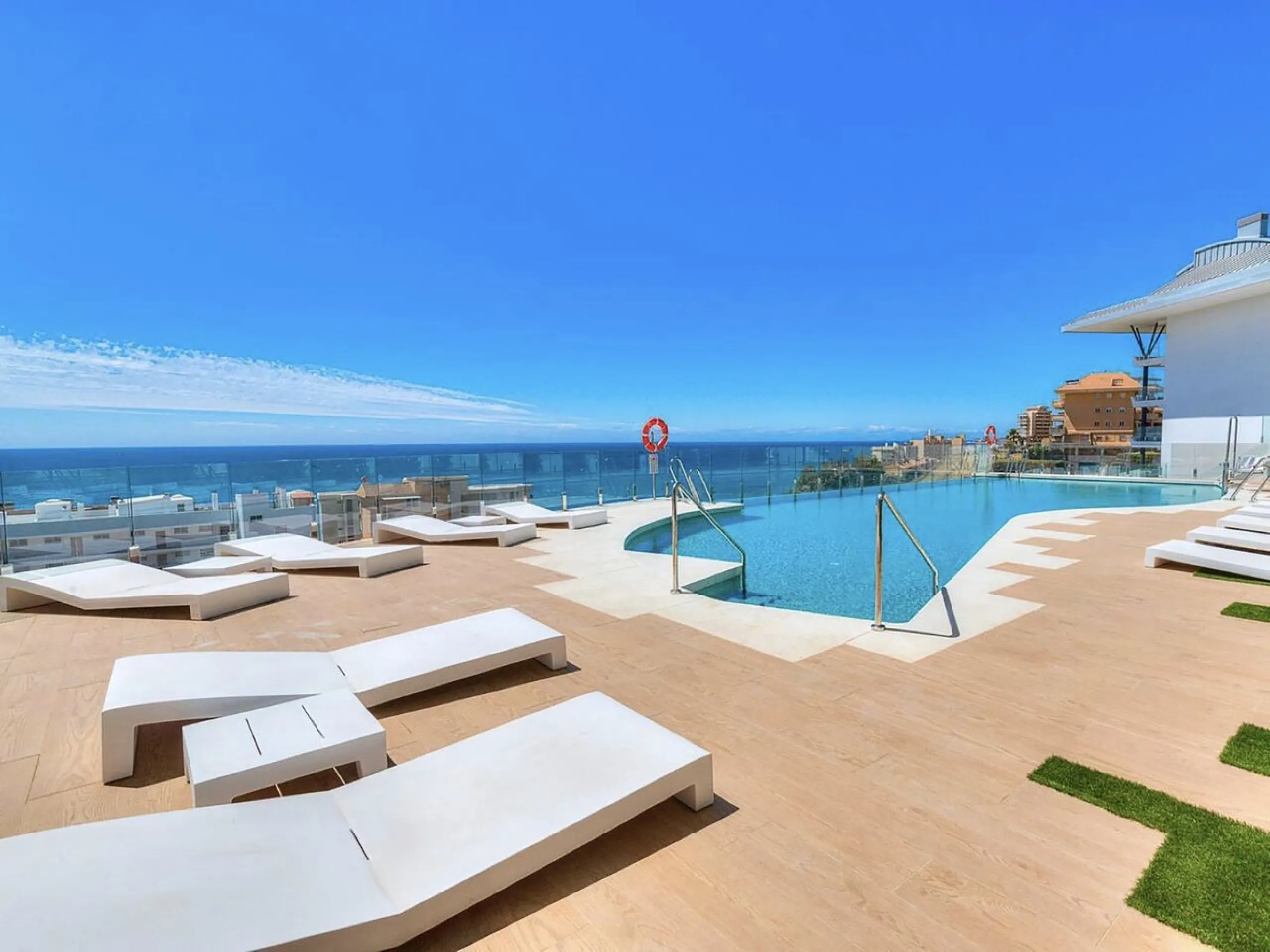 REDUCED - Stunning 2 bed duplex Penthouse only 100m to beach, shops & restaurants, with breathtaking 180º Mediterranean sea views. Set in exclusive El Higueron luxury Sports / Spa community with own beach Club.