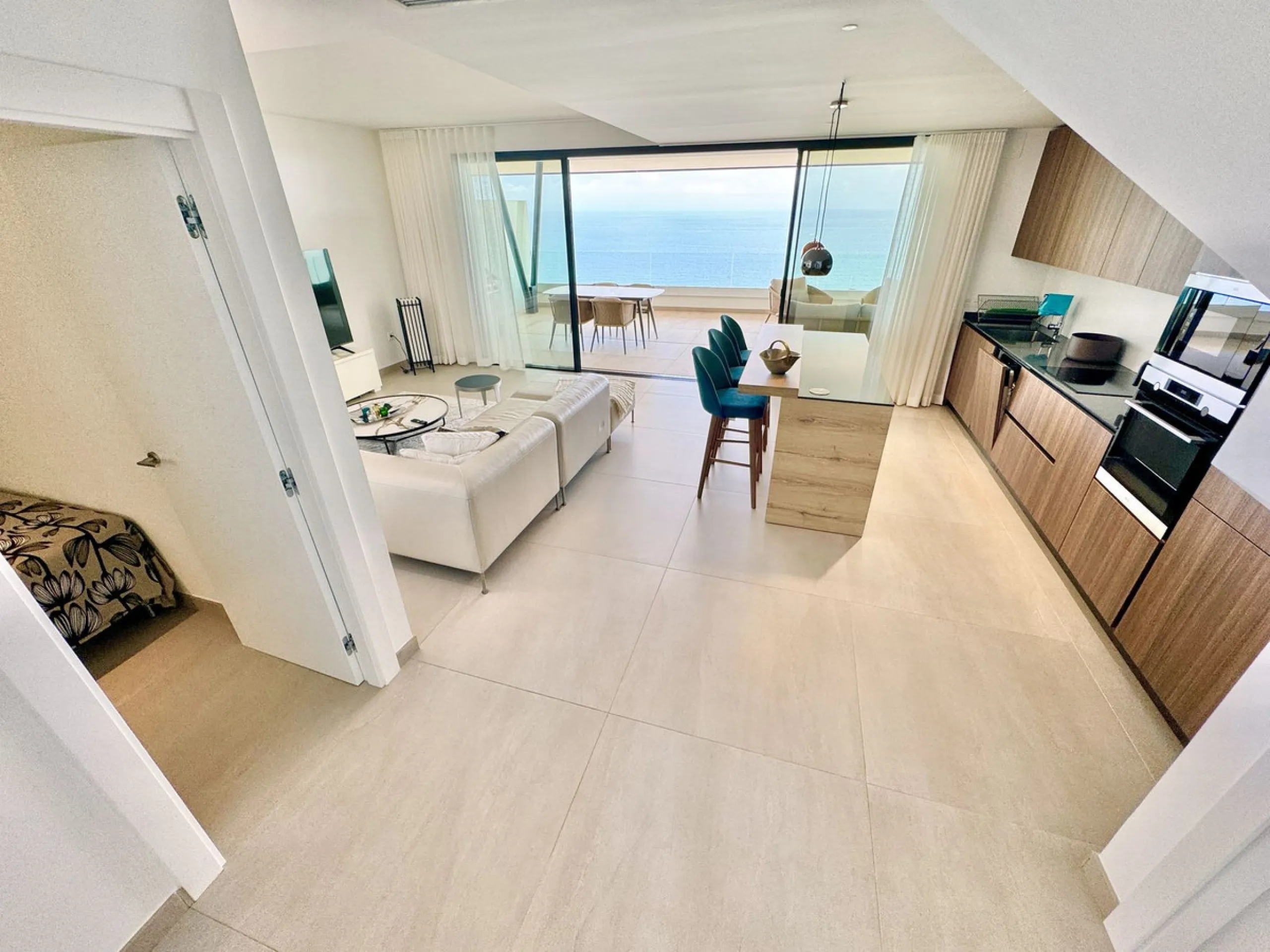 REDUCED - Stunning 2 bed duplex Penthouse only 100m to beach, shops & restaurants, with breathtaking 180º Mediterranean sea views. Set in exclusive El Higueron luxury Sports / Spa community with own beach Club.