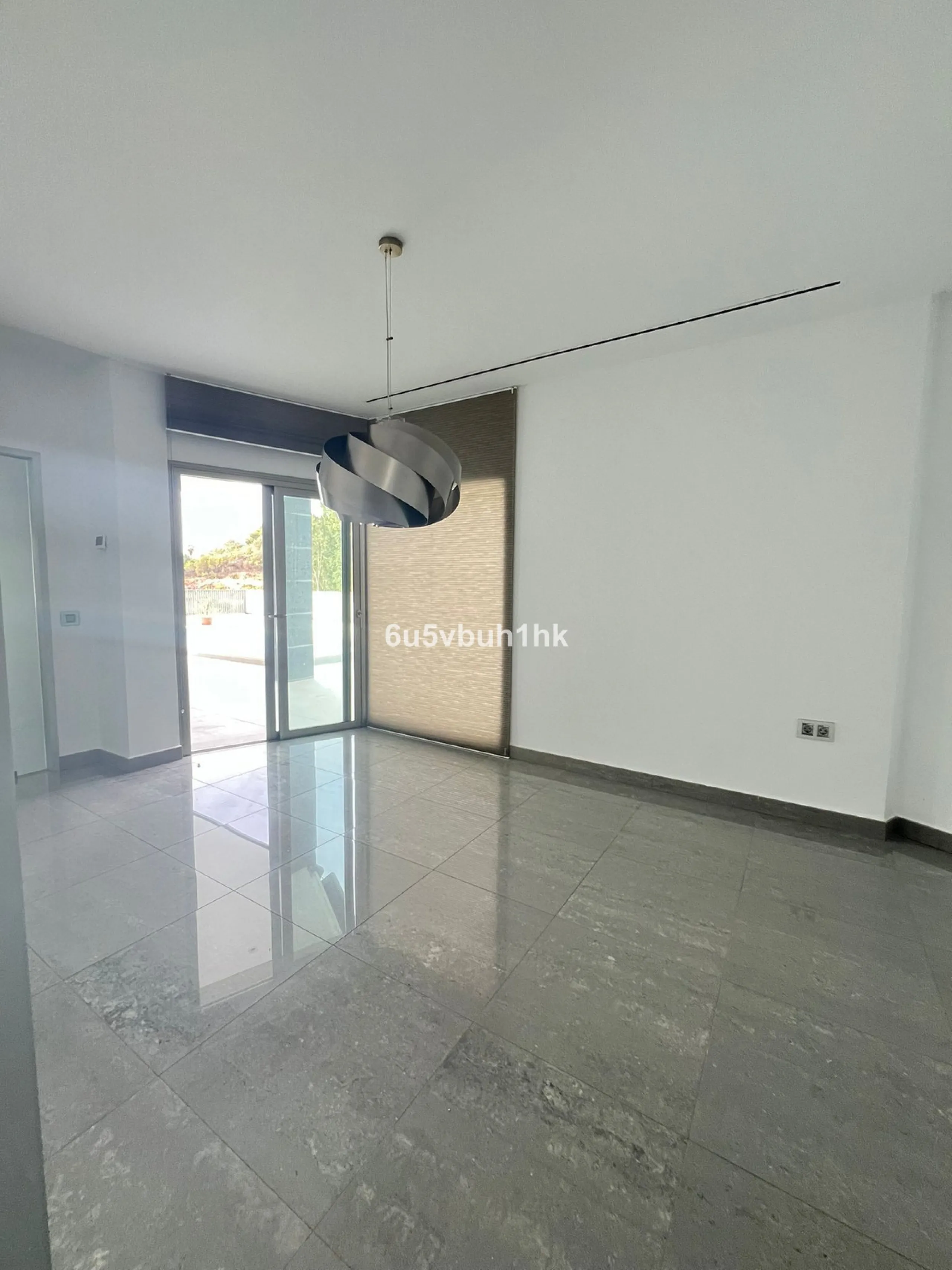This spacious modern villa is located in a prime area of Benalmádena, near Xanit Hospital, and enjoys clear views toward a protected area where construction is not permitted, ensuring privacy and the tranquility of having hardly any nearby neighbors.