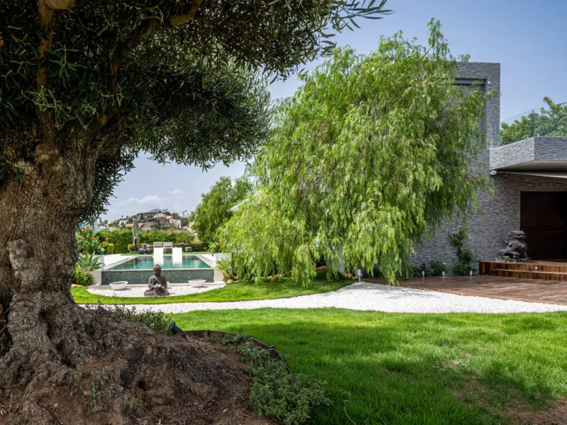 Villa TrueLove is a six-bedroom, five-bathroom luxury villa in the heart of Benahavís. It offers stunning mountain and garden views, combining modern technology with natural design. The home features a seamless connection between indoor and outdoor living