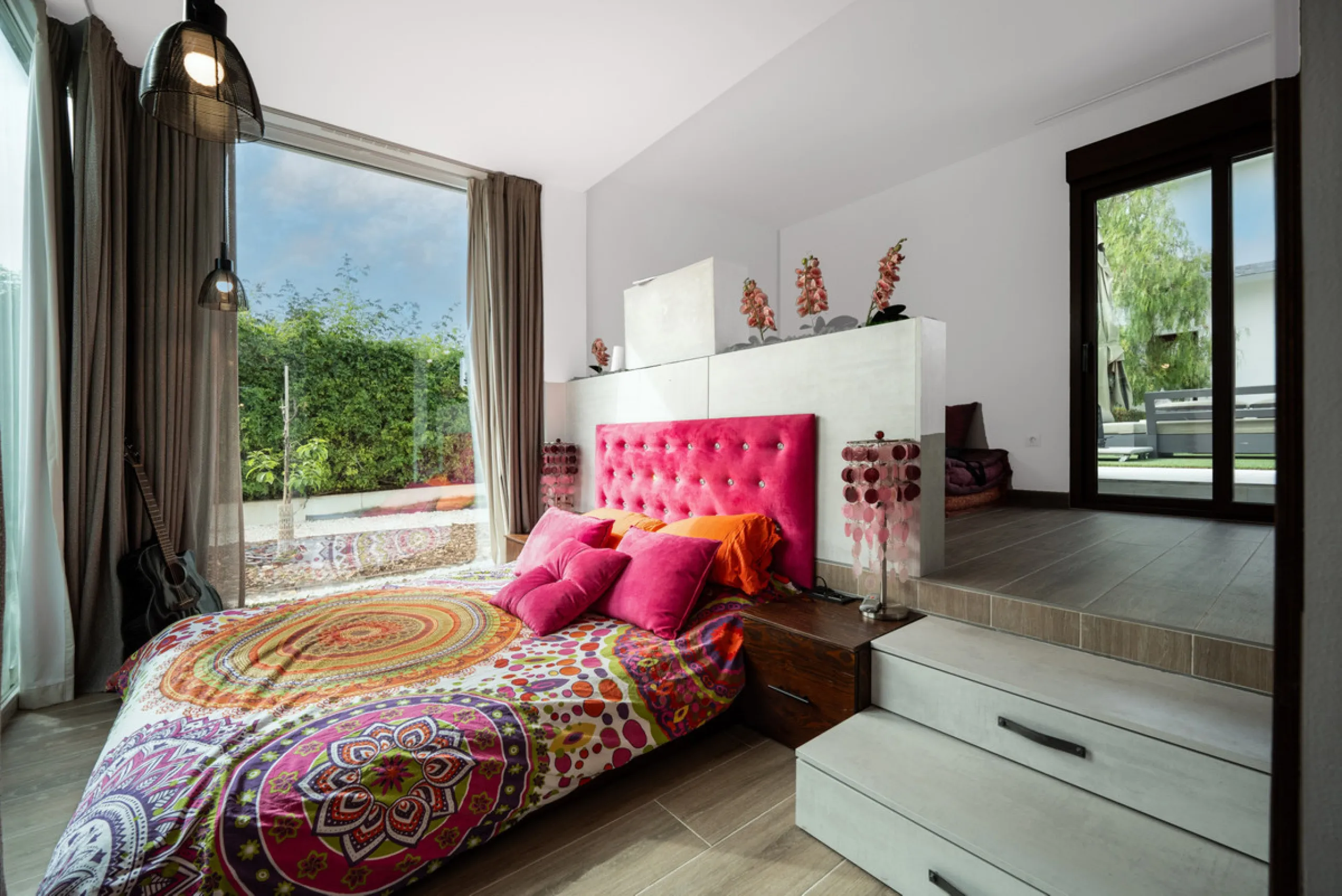 Villa TrueLove is a six-bedroom, five-bathroom luxury villa in the heart of Benahavís. It offers stunning mountain and garden views, combining modern technology with natural design. The home features a seamless connection between indoor and outdoor living