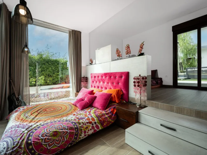 Villa TrueLove is a six-bedroom, five-bathroom luxury villa in the heart of Benahavís. It offers stunning mountain and garden views, combining modern technology with natural design. The home features a seamless connection between indoor and outdoor living