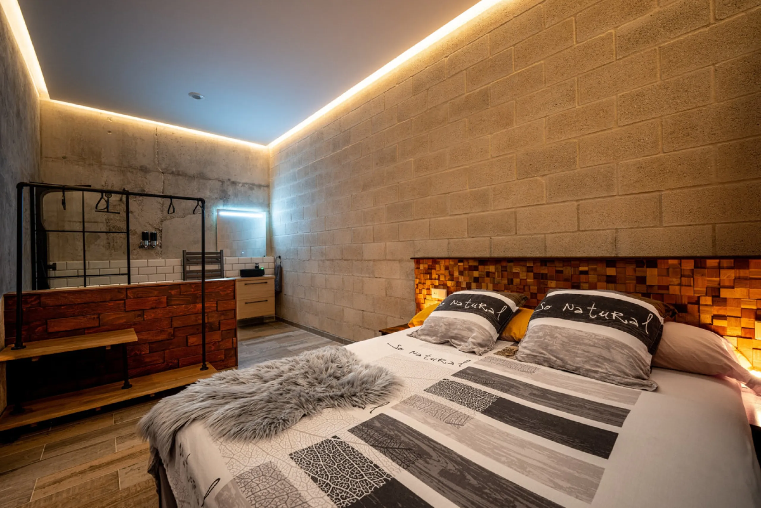Villa TrueLove is a six-bedroom, five-bathroom luxury villa in the heart of Benahavís. It offers stunning mountain and garden views, combining modern technology with natural design. The home features a seamless connection between indoor and outdoor living