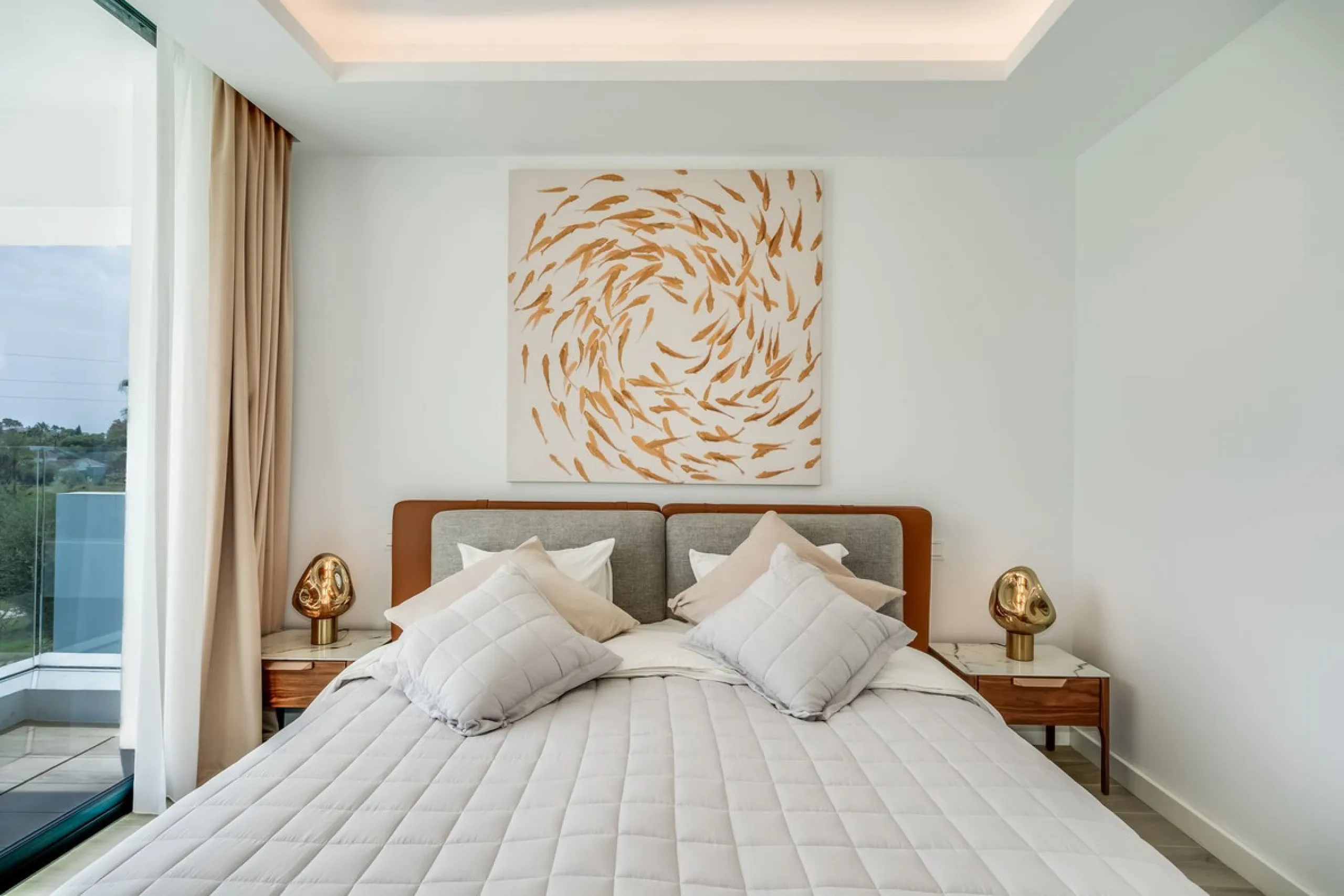 Nestled along the lush greens of Marbella's finest golf course of El Campanario, this luxurious 5-bedroom, 4.5-bath villa offers a seamless blend of elegance and state-of-the-art comfort over 460 square meters of living space. The villa's open layout invi