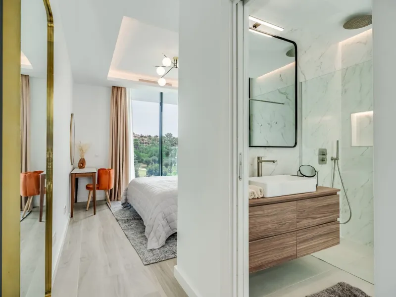 Nestled along the lush greens of Marbella's finest golf course of El Campanario, this luxurious 5-bedroom, 4.5-bath villa offers a seamless blend of elegance and state-of-the-art comfort over 460 square meters of living space. The villa's open layout invi