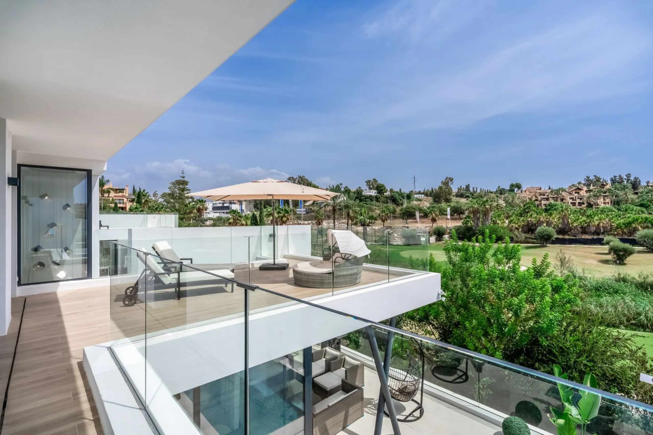 Nestled along the lush greens of Marbella's finest golf course of El Campanario, this luxurious 5-bedroom, 4.5-bath villa offers a seamless blend of elegance and state-of-the-art comfort over 460 square meters of living space. The villa's open layout invi