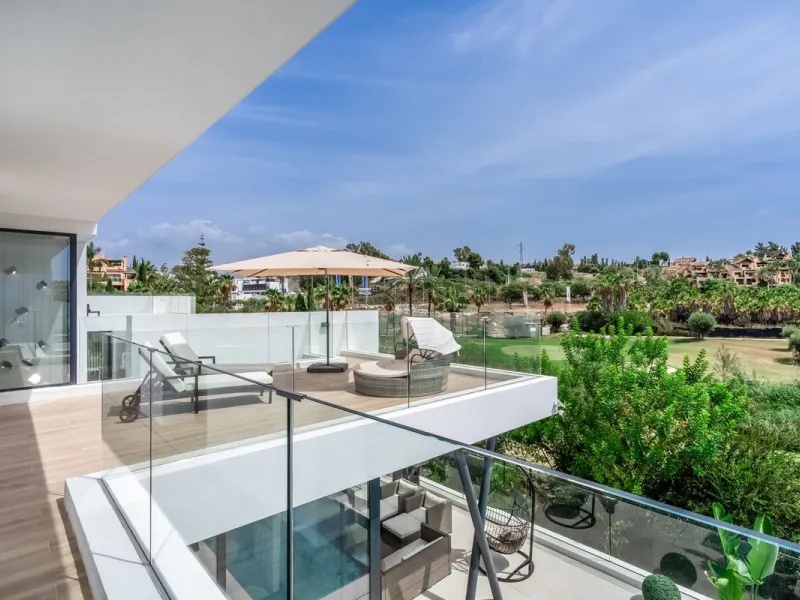 Nestled along the lush greens of Marbella's finest golf course of El Campanario, this luxurious 5-bedroom, 4.5-bath villa offers a seamless blend of elegance and state-of-the-art comfort over 460 square meters of living space. The villa's open layout invi