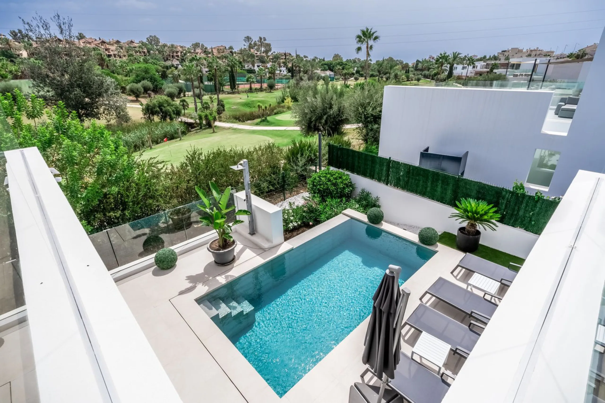 Nestled along the lush greens of Marbella's finest golf course of El Campanario, this luxurious 5-bedroom, 4.5-bath villa offers a seamless blend of elegance and state-of-the-art comfort over 460 square meters of living space. The villa's open layout invi