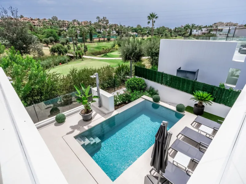 Nestled along the lush greens of Marbella's finest golf course of El Campanario, this luxurious 5-bedroom, 4.5-bath villa offers a seamless blend of elegance and state-of-the-art comfort over 460 square meters of living space. The villa's open layout invi