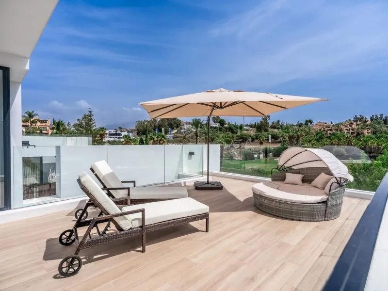 Nestled along the lush greens of Marbella's finest golf course of El Campanario, this luxurious 5-bedroom, 4.5-bath villa offers a seamless blend of elegance and state-of-the-art comfort over 460 square meters of living space. The villa's open layout invi