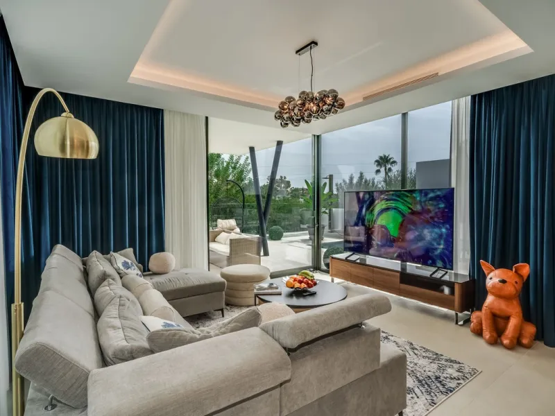Nestled along the lush greens of Marbella's finest golf course of El Campanario, this luxurious 5-bedroom, 4.5-bath villa offers a seamless blend of elegance and state-of-the-art comfort over 460 square meters of living space. The villa's open layout invi