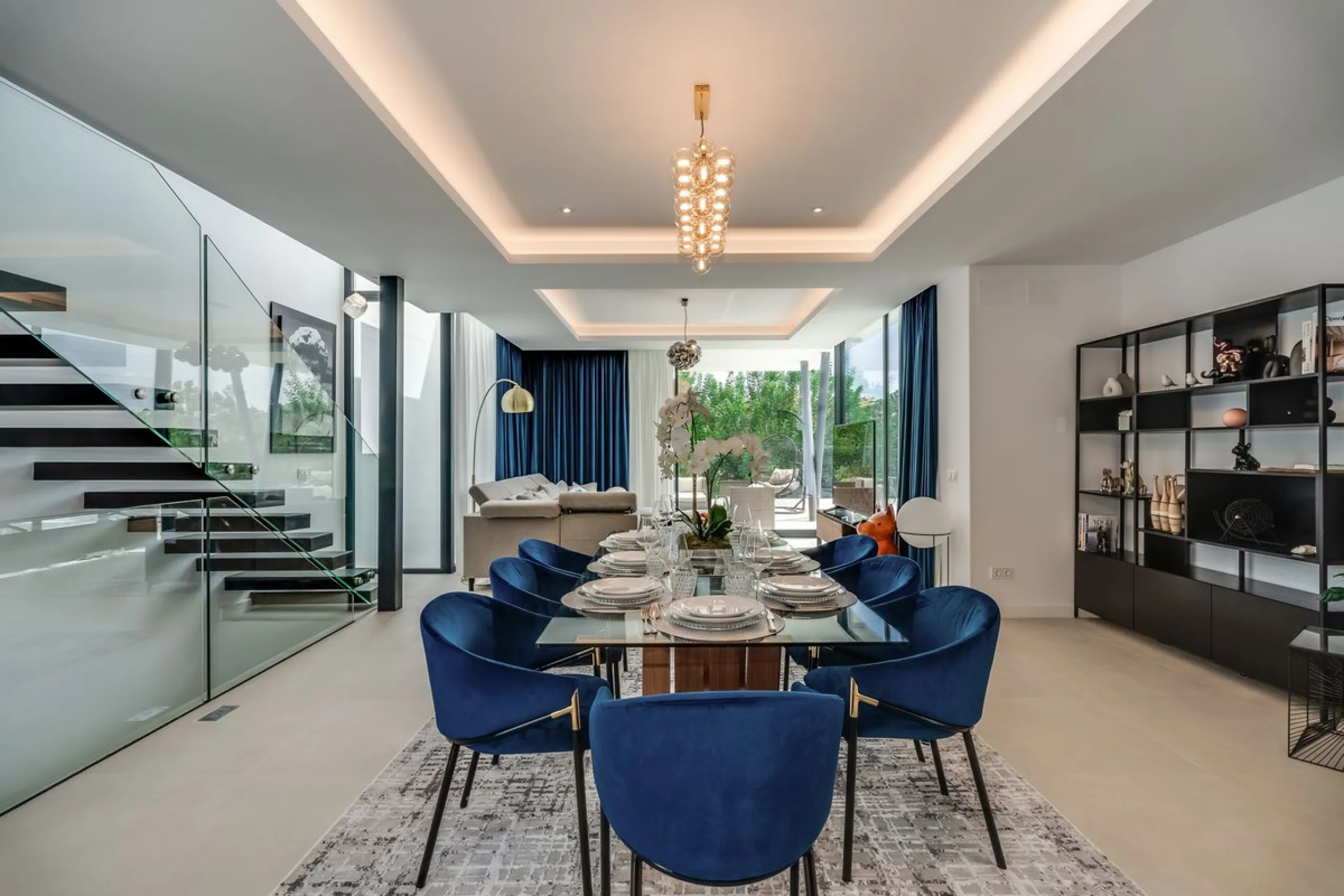 Nestled along the lush greens of Marbella's finest golf course of El Campanario, this luxurious 5-bedroom, 4.5-bath villa offers a seamless blend of elegance and state-of-the-art comfort over 460 square meters of living space. The villa's open layout invi
