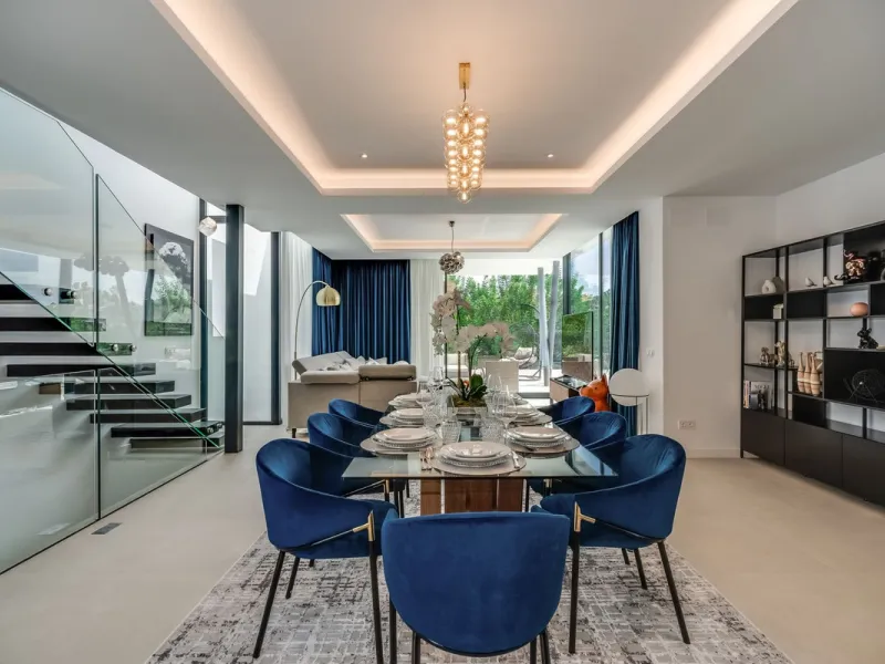 Nestled along the lush greens of Marbella's finest golf course of El Campanario, this luxurious 5-bedroom, 4.5-bath villa offers a seamless blend of elegance and state-of-the-art comfort over 460 square meters of living space. The villa's open layout invi