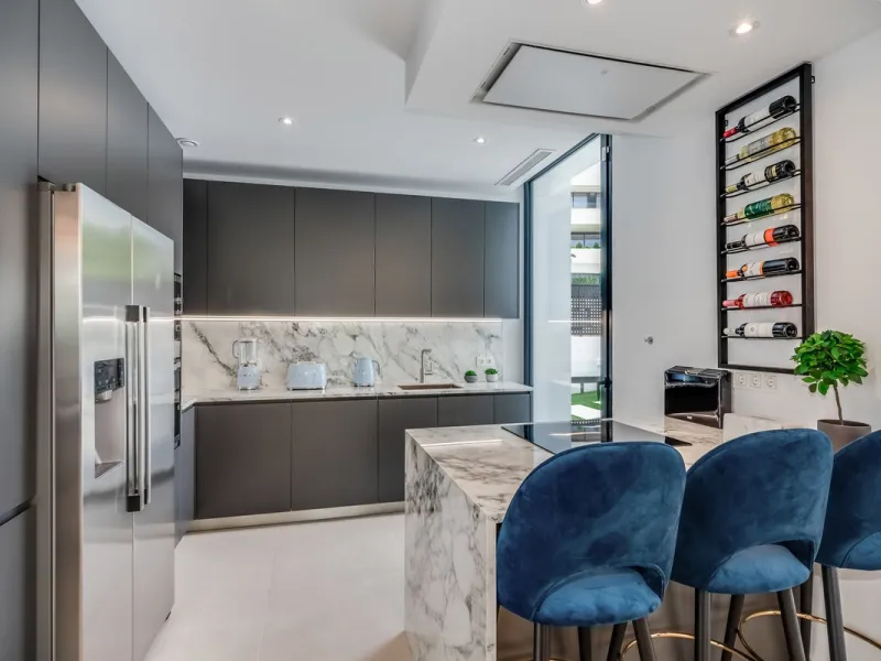 Nestled along the lush greens of Marbella's finest golf course of El Campanario, this luxurious 5-bedroom, 4.5-bath villa offers a seamless blend of elegance and state-of-the-art comfort over 460 square meters of living space. The villa's open layout invi